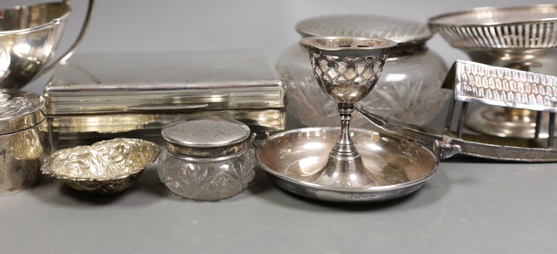Miscellaneous silver ware including a mounted cigarette box, mounted posy vase, egg cup stand, late Victorian circular box and cover, repousse dish, eight sterling items including flatware and three other items.
